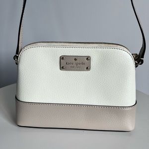 Kate Spade Dome crossbody purse in taupe and white.